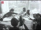 Beatles member John Lennon and new wife Yoko Ono stage a bed-in in Amsterdam